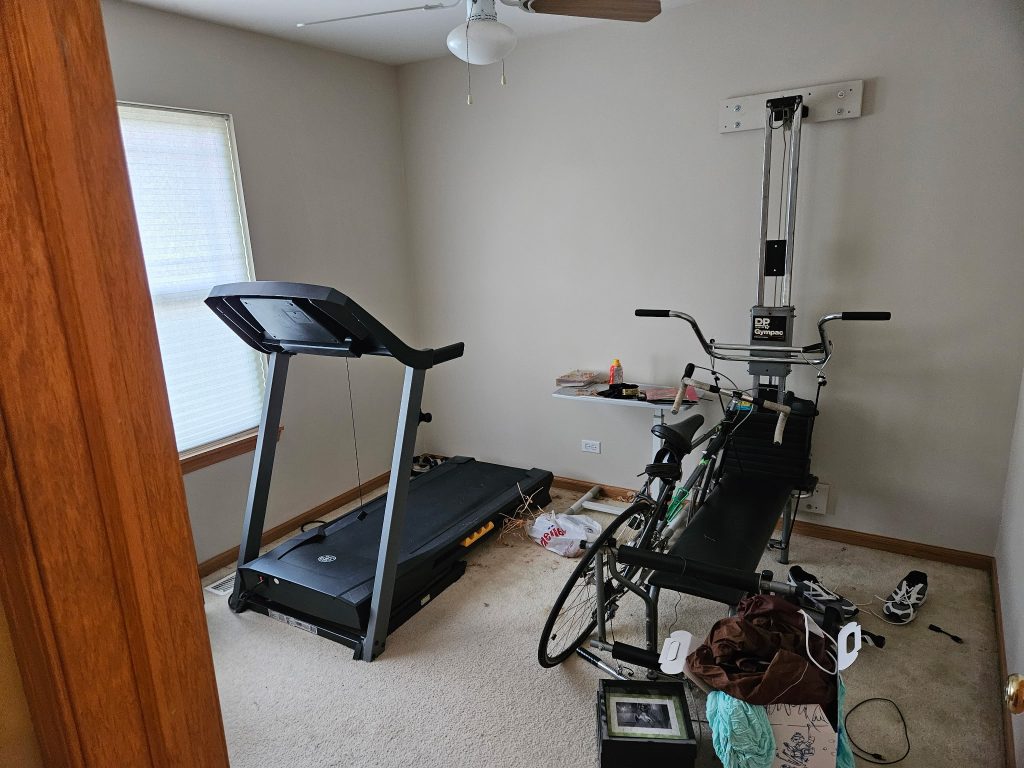 Treadmill and home gym equipment staged for removal by Junk Nurse in Aurora IL