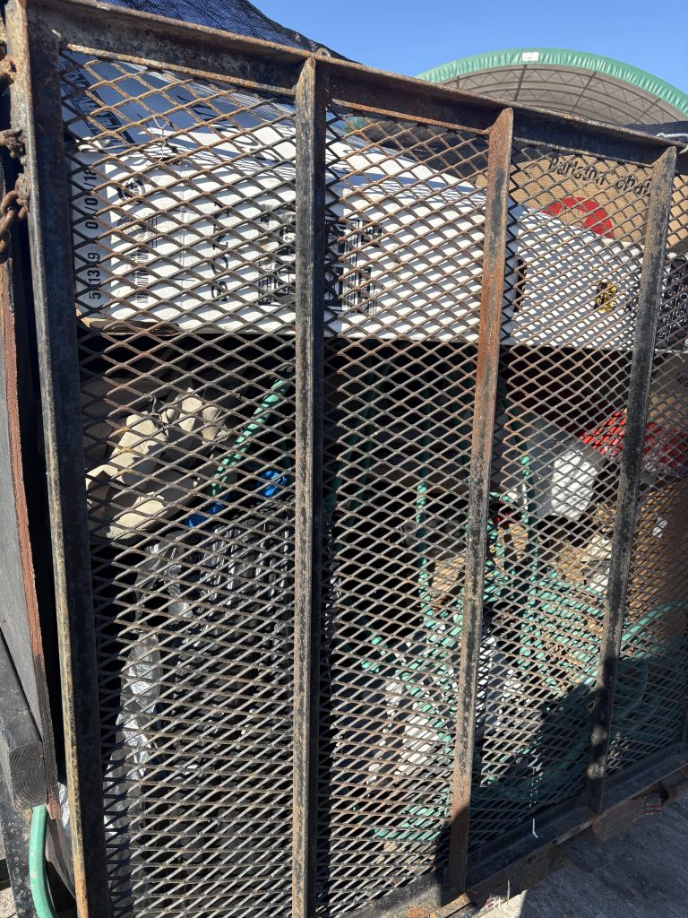 Junk Nurse mesh trailer packed full of junk and loose debris after a removal job in the Oswego IL area