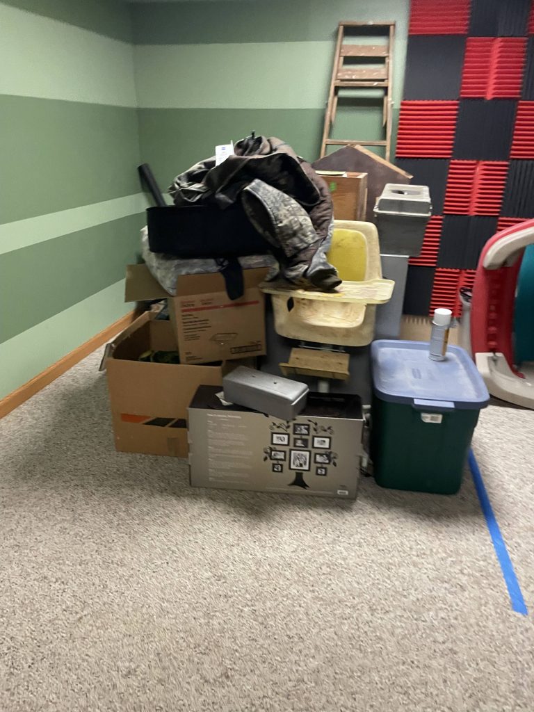 Large pile of boxes and mixed junk staged for removal during estate cleanout by Junk Nurse in Aurora IL