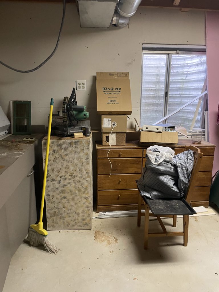 Room with dresser, mattress, and boxes being cleared during a furniture removal job by Junk Nurse in Aurora IL