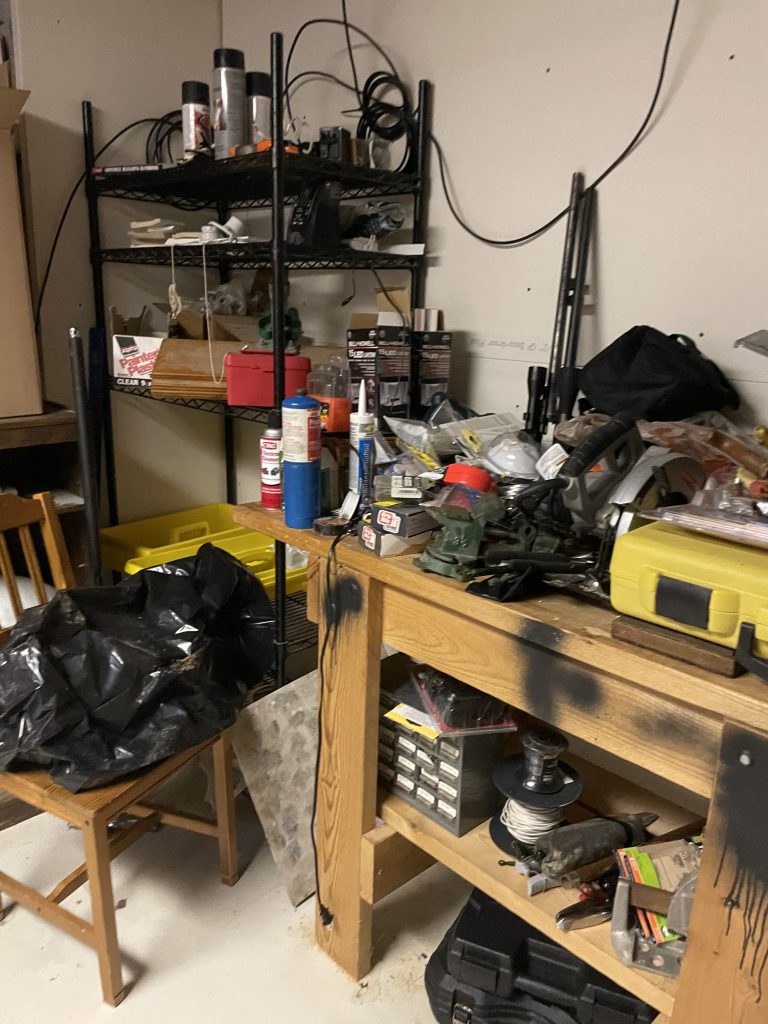 Basement workshop packed with tools, equipment and junk before removal by Junk Nurse in Aurora IL