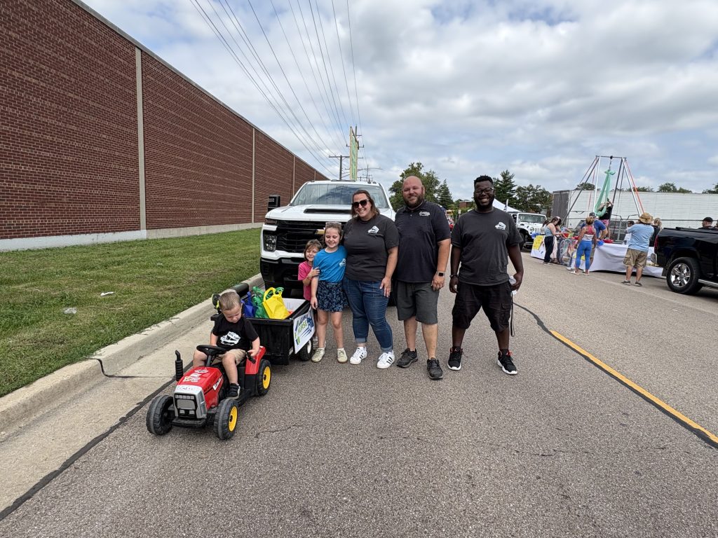 Alex Welsch and family at an Aurora IL community parade with the Junk Nurse truck
