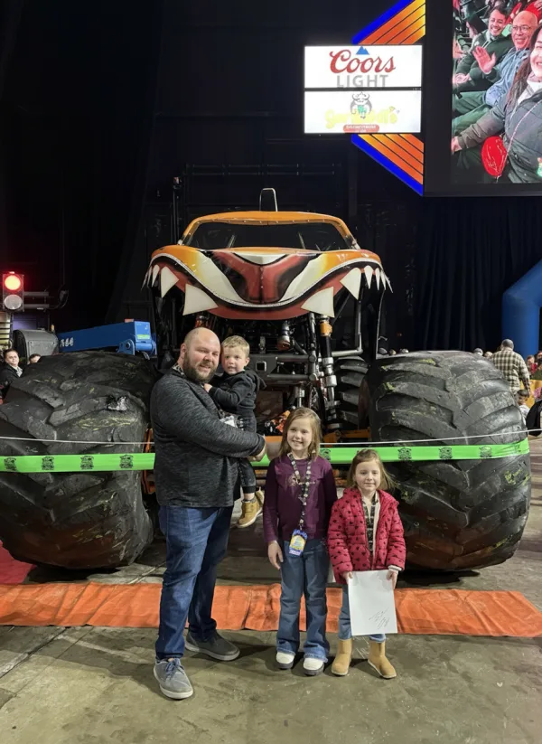 Alex Welsch, owner of Junk Nurse, with his family at a monster truck show